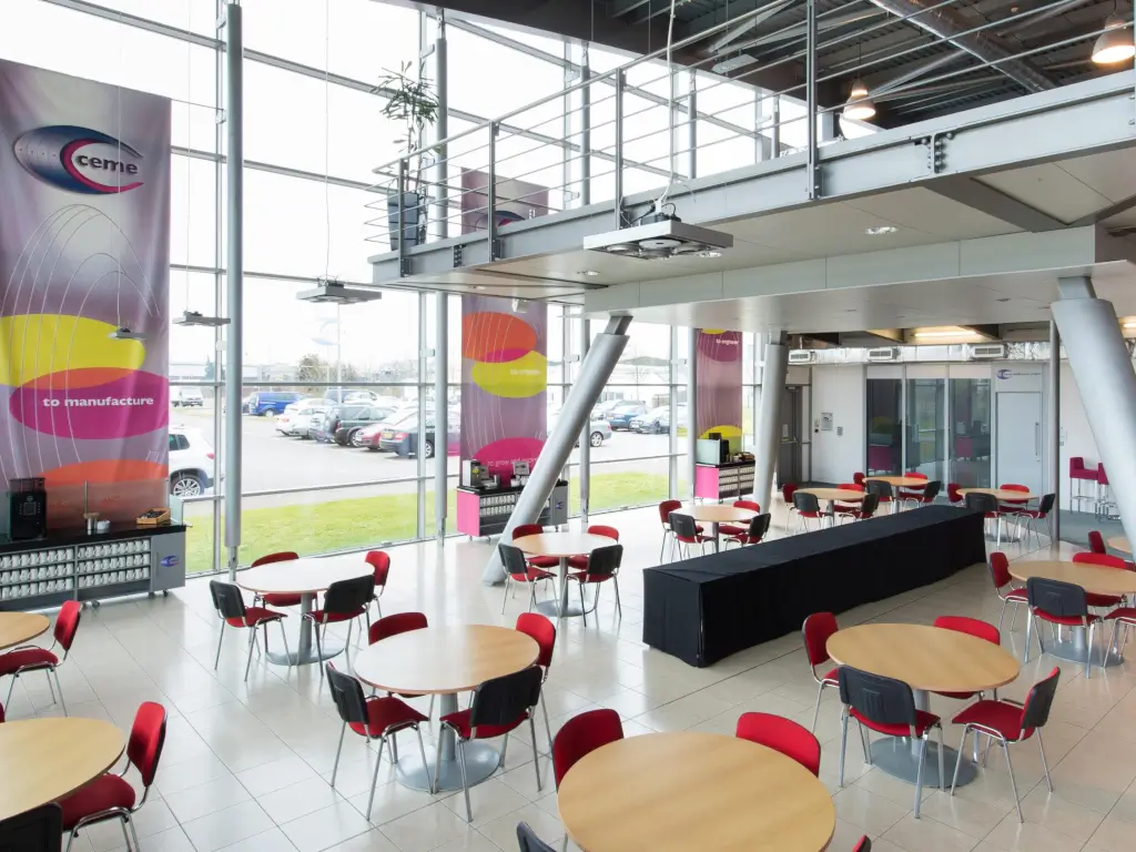 Bright CEME atrium with seating and floor-to-ceiling glass