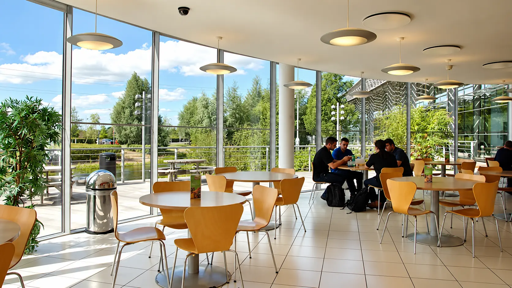 Café seating area with lake views and natural light