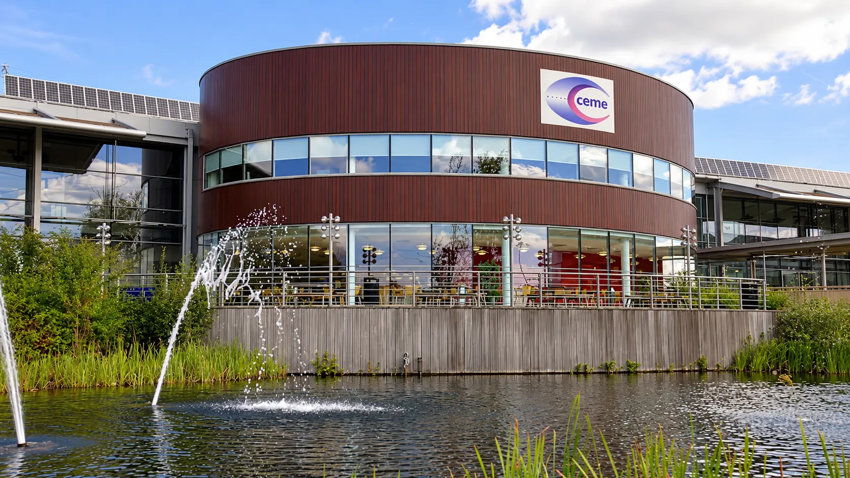 CEME Business Campus fountain and lakeside walkway in daylight