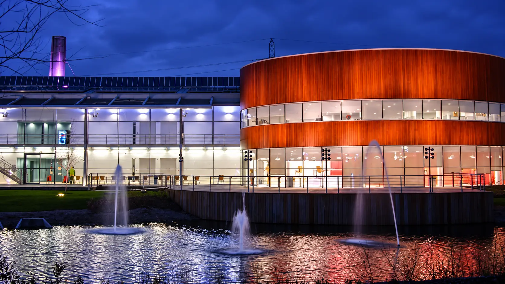 CEME Campus building and fountains lit up at night